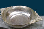 Carved vessel bathed in Silver