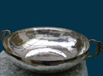 Hammered vessel  bathed in Silver